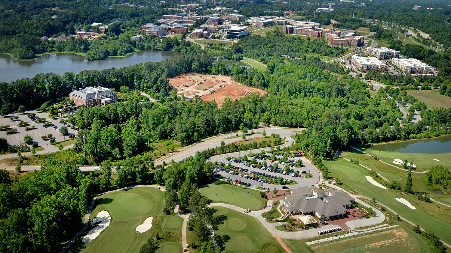 Campus aerial with Alumni Center and gold course