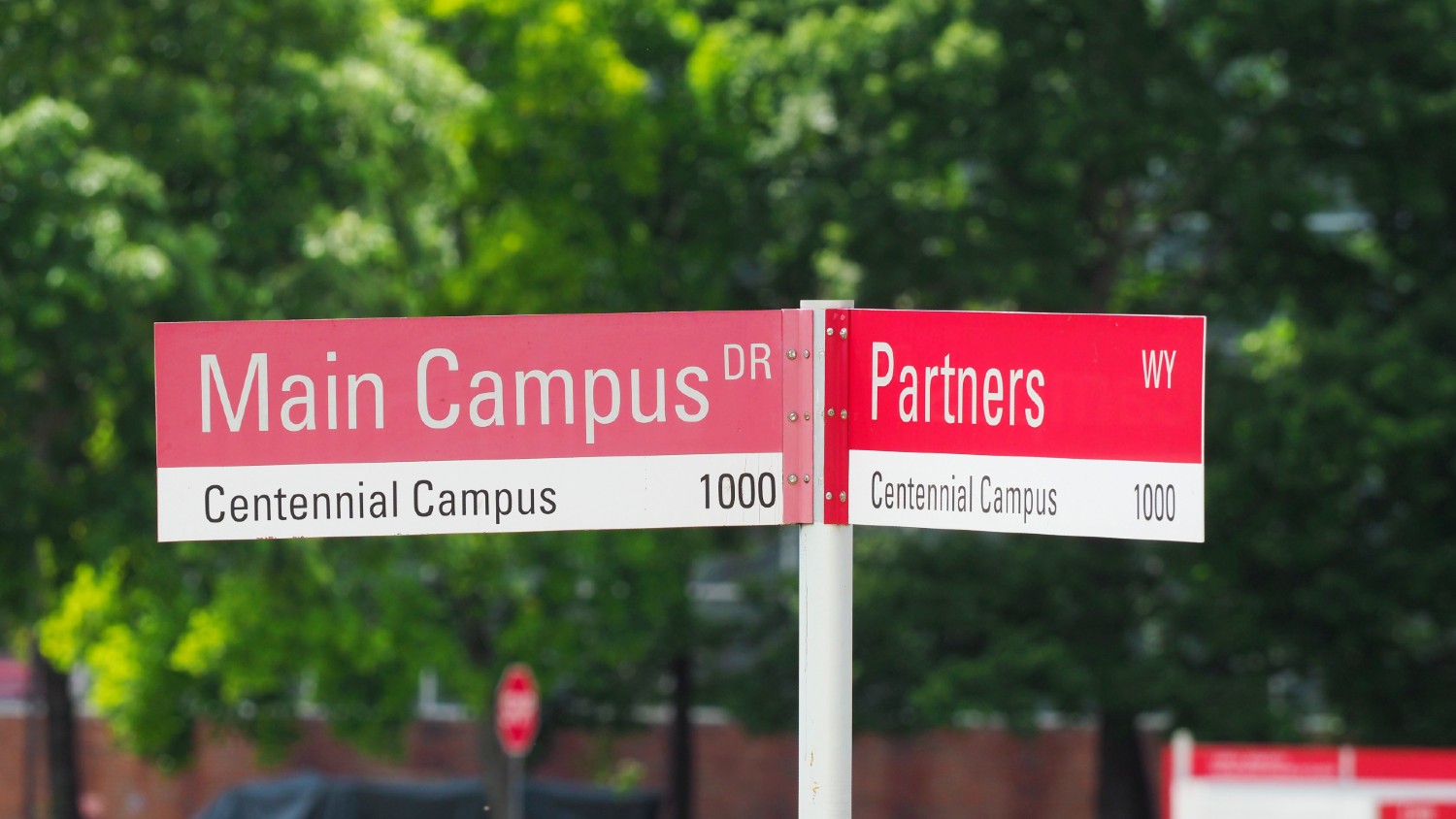 Signs at the intersection of main campus and partners drive